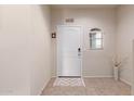 Front entry with tile flooring and a decorative rug at 31045 W Cheery Lynn Rd, Buckeye, AZ 85396