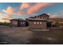 Luxury home with stone and stucco exterior, set on a hillside lot at 36430 N 34Th Ave, Phoenix, AZ 85086