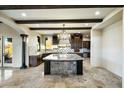 Gourmet kitchen with granite island, dark wood cabinets, and high-end appliances at 36430 N 34Th Ave, Phoenix, AZ 85086