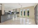 Eat-in kitchen with granite countertops and white cabinets at 5013 W Orchid Ln, Glendale, AZ 85302