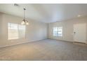 Open living area with light walls and carpeting at 5427 W St Kateri Dr, Laveen, AZ 85339