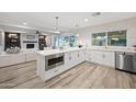 Modern kitchen with white shaker cabinets, quartz countertops, and stainless steel appliances at 6547 E Eugie Ter, Scottsdale, AZ 85254