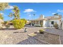 Landscaped backyard with gravel and a sun shade structure at 745 Leisure World --, Mesa, AZ 85206