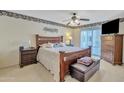 Spacious bedroom with wood furniture and access to a patio at 745 Leisure World --, Mesa, AZ 85206