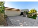 View of the house's driveway and garage at 8100 E Camelback Rd # 14, Scottsdale, AZ 85251