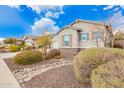 Single-story home with neutral exterior, and landscaped yard at 9364 W Cashman Dr, Peoria, AZ 85383