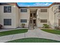 Condo building exterior with stairs and landscaping at 9990 N Scottsdale Rd # 1048, Paradise Valley, AZ 85253