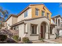 Two-story house with red door and neutral exterior at 106 N 66Th Ave, Phoenix, AZ 85043