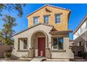 Two-story house with red door and neutral exterior at 106 N 66Th Ave, Phoenix, AZ 85043
