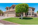 Two-story house with a two-car garage and well-manicured lawn at 1116 W Courtney Ln, Tempe, AZ 85284