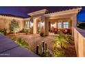 Private courtyard with water feature, seating area, and mature plants at 13286 W Micheltorena Ct, Sun City West, AZ 85375