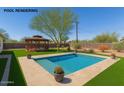 Backyard pool featuring a gazebo, a beautiful tree, and manicured landscaping at 134 N 87Th St, Mesa, AZ 85207