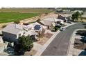 Aerial view showcasing the neighborhood and home's location at 15058 W Fillmore St, Goodyear, AZ 85338