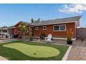 Updated brick home with putting green and side yard at 1561 W 5Th St, Mesa, AZ 85201