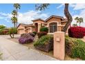 Beautiful home featuring colorful landscaping, a charming mailbox, and a well-maintained exterior at 18001 N 53Rd St, Scottsdale, AZ 85254