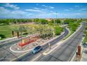 Aerial view of community featuring parks and roads at 19684 N 260Th Ave, Buckeye, AZ 85396