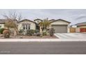 Single story home with a two-car garage and well manicured front yard at 2796 E Inca Ln, San Tan Valley, AZ 85140