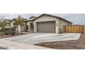 Attached two-car garage with a long driveway at 2796 E Inca Ln, San Tan Valley, AZ 85140