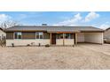 Inviting home featuring neutral tones, desert landscaping, and a convenient carport at 3717 W Charter Oak Rd, Phoenix, AZ 85029