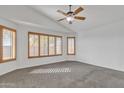 Spacious bedroom with neutral carpeting and large windows with plantation shutters at 41654 N Ranch Dr, San Tan Valley, AZ 85140