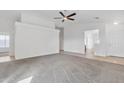 Bright and airy living room with neutral carpeting and ample natural light at 41654 N Ranch Dr, San Tan Valley, AZ 85140