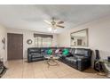 Living room with leather sectional sofa and large mirror at 4219 W Pasadena Ave, Phoenix, AZ 85019