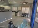 Bright dining area with glass table and chairs, adjacent to kitchen at 4330 E South Fork Dr, Phoenix, AZ 85044