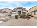 Two-story house with a two-car garage and desert landscaping at 44230 W Palmen Dr, Maricopa, AZ 85138