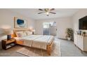 Bright bedroom with wood-toned furniture and access to patio at 4648 W Continental Dr, Glendale, AZ 85308