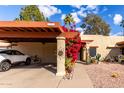 Covered parking and lush landscaping enhance this home's exterior at 507 S Sand Verbena Way, Mesa, AZ 85208