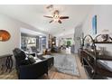 Spacious living room with hardwood floors, comfy seating, and a large window at 5241 E Ingram St, Mesa, AZ 85205