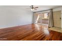 Living room with hardwood floors and door to outside at 6501 N 17Th Ave # 112, Phoenix, AZ 85015