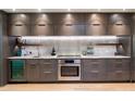 Modern kitchen with sleek cabinetry, stainless steel appliances, and granite countertops at 7500 E Mccormick Pkwy # 32, Scottsdale, AZ 85258