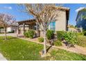 Single-story home with a covered porch and landscaped yard at 7520 E Peralta Ave, Mesa, AZ 85212