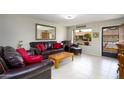 Bright living room with view to backyard and access to patio at 7755 E Laguna Azul Ave # 147, Mesa, AZ 85209