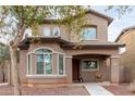 Two-story house with a front porch and walkway at 9331 S 33Rd Gln, Laveen, AZ 85339