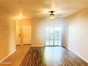 Bright and airy living room with wood-look floors and access to patio at 10136 E Southern Ave # 1110, Mesa, AZ 85209