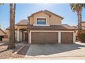 Two-story house with three-car garage and desert landscaping at 10359 W Sunflower Pl, Avondale, AZ 85392