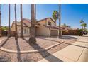 Two-story house with three-car garage and palm trees at 10359 W Sunflower Pl, Avondale, AZ 85392