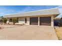 Two-car garage and a long driveway at 1122 W Dragoon Ave, Mesa, AZ 85210