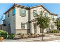 Two-story house with light-colored exterior, landscaping, and a gated entryway at 11695 N 166Th Ln, Surprise, AZ 85388