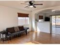 Bright living room featuring hardwood floors and a view into the kitchen at 1302 E 30Th Ave, Apache Junction, AZ 85119