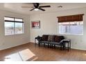 Living room with hardwood floors and large windows offering natural light at 1302 E 30Th Ave, Apache Junction, AZ 85119