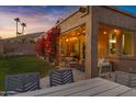 Relaxing backyard patio with seating, fire pit, and string lights at 15632 S 6Th St, Phoenix, AZ 85048