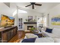 Bright living room with hardwood floors, fireplace, and comfortable seating at 15801 N 51St St, Scottsdale, AZ 85254