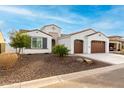 Beautiful single-story home with a two-car garage and drought tolerant landscaping with tasteful stone at 16639 W Pinchot Ave, Goodyear, AZ 85395