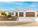 Charming single-story home with a two-car garage, desert landscaping, and a welcoming facade at 16639 W Pinchot Ave, Goodyear, AZ 85395