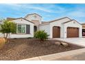 Beautiful single-story home with a two-car garage and drought tolerant landscaping with tasteful stone at 16639 W Pinchot Ave, Goodyear, AZ 85395