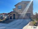 Two-story house with a two-car garage and desert landscaping at 18225 W Yavapai St, Goodyear, AZ 85338