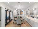 Open concept dining area with round table and chairs, adjacent to kitchen at 2430 E Palo Verde Dr, Phoenix, AZ 85016